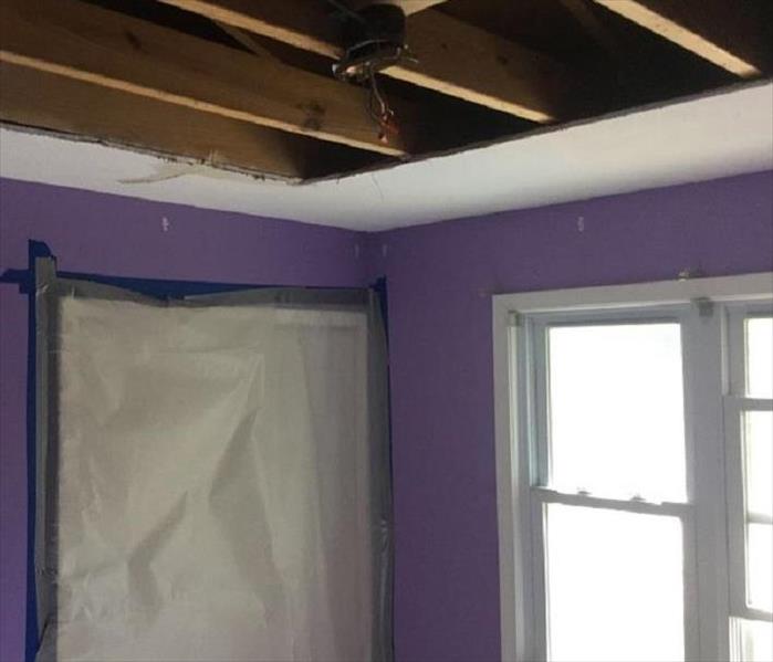 ceiling torn out to repair water damage in Cleveland