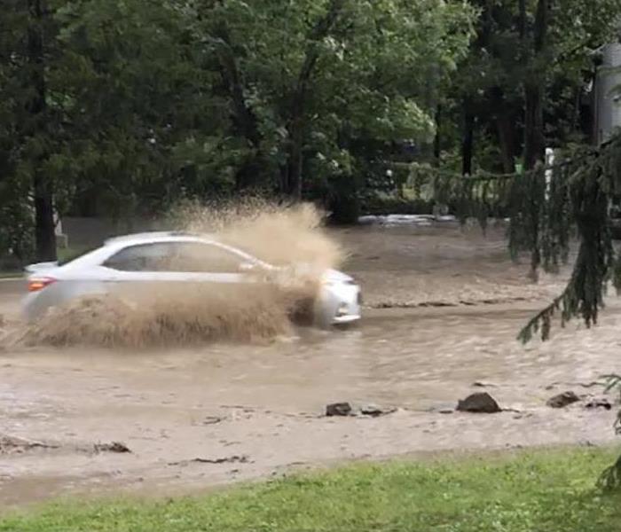 car going through water